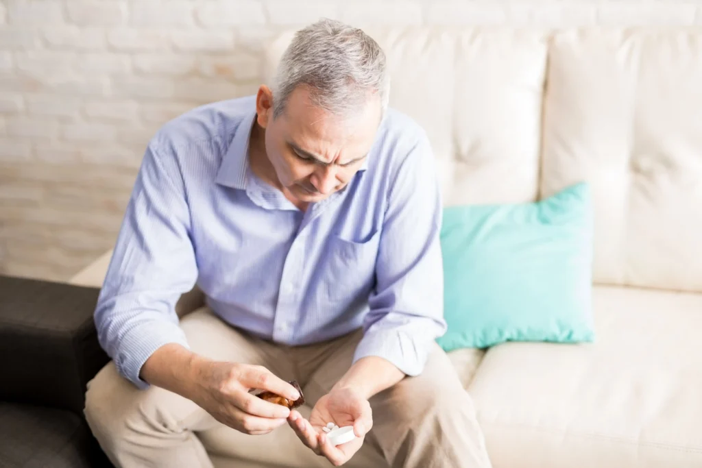 Person taking a pill after noticing symptom