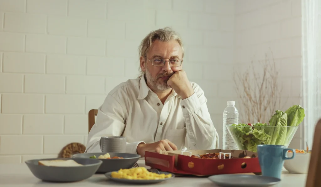 Adult eating a meal while experiencing changes in appetite